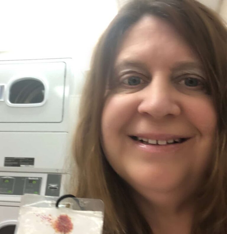 Tracy Savona is doing laundry for her client